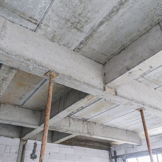 Building under construction with iron steel support concrete beams